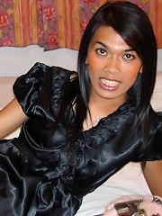 Exotic ladyboy in black lingerie posing